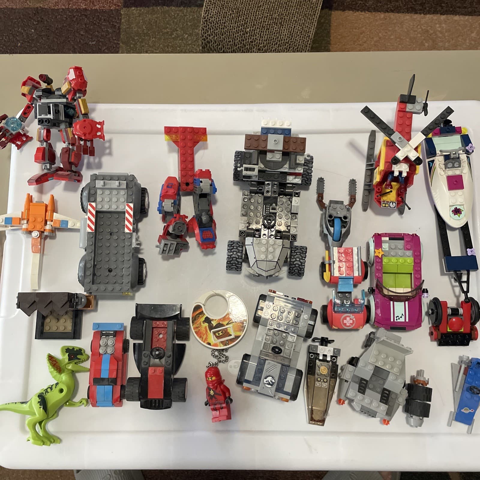 Listing photo for Random Lot of Legos-Vehicles, Mechs, Marvel, Jurassic Park, Ninjago