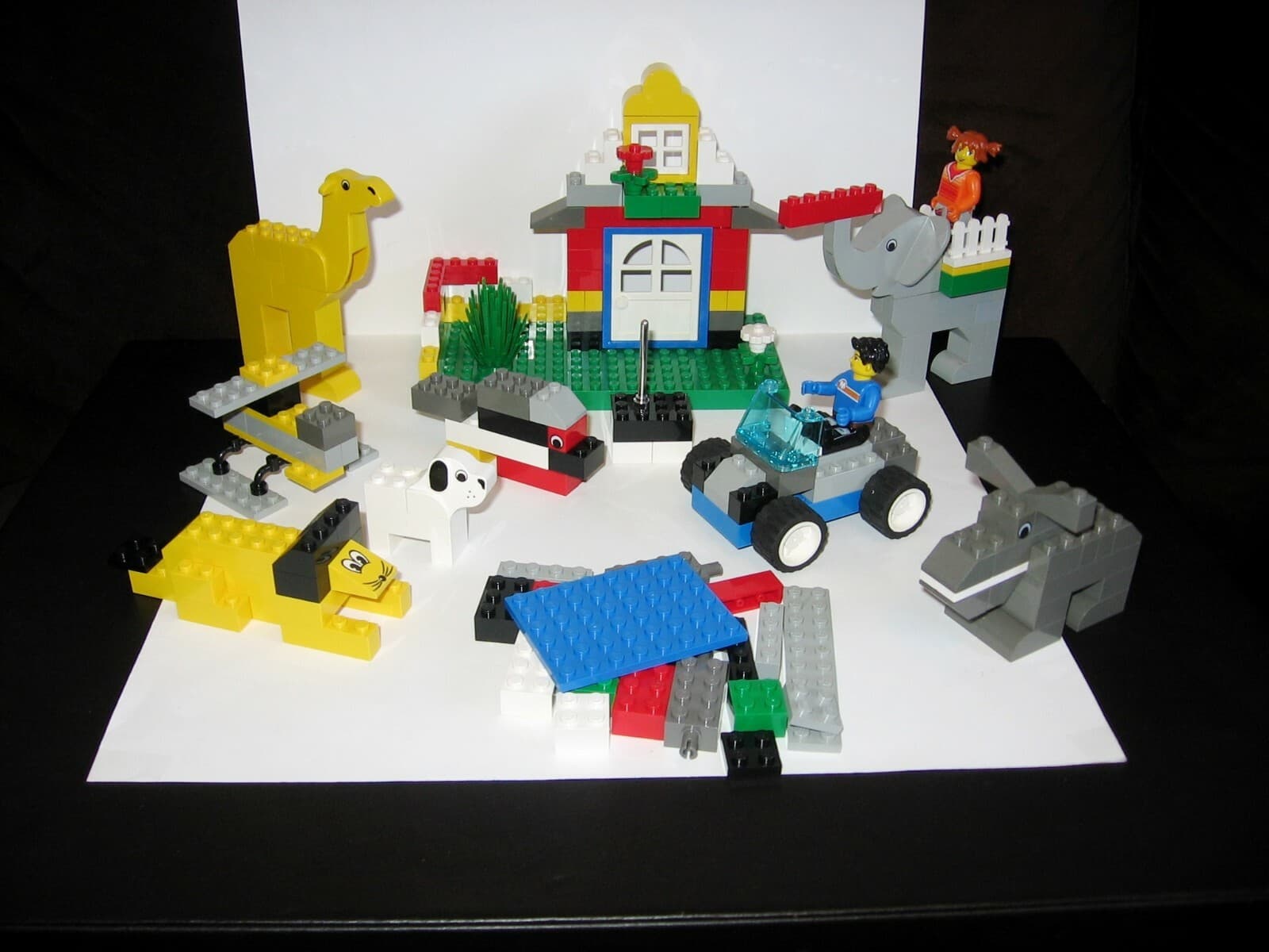 Listing photo for Lego set 4116 Animal Adventures Bucket – 211 Pieces – 2 Figures - Creator